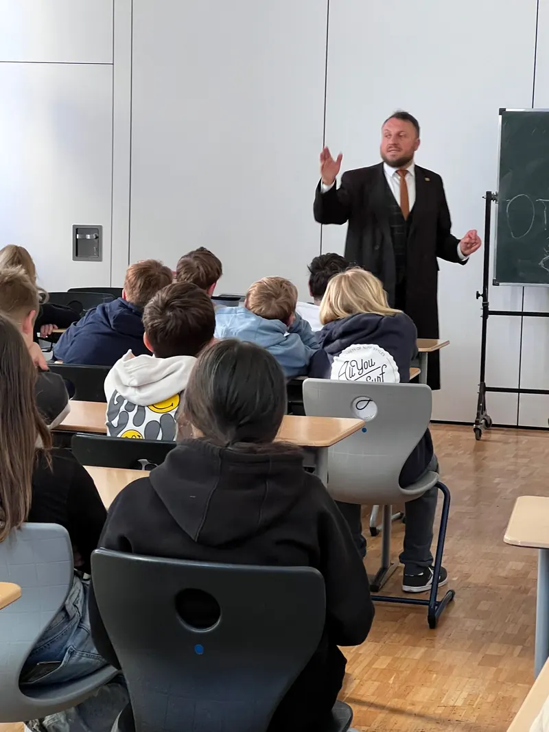 A rabbi speaking to a school class