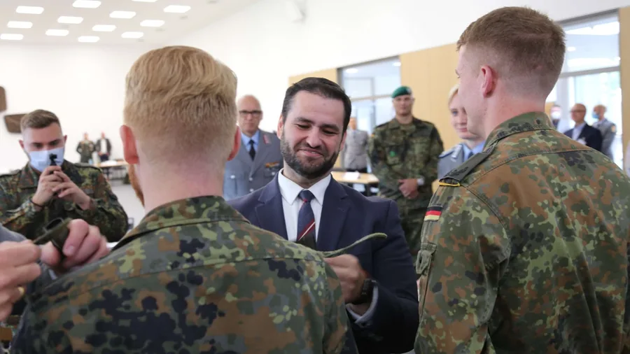 A rabbi in conversation with a group of soldiers