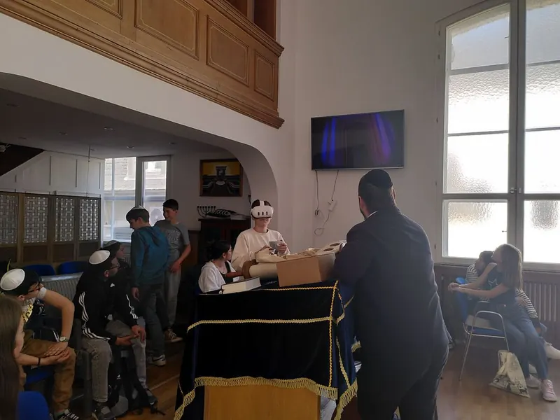 Young people visiting a synagogue with an Ambassador